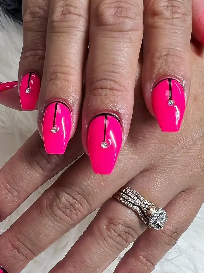 Hot pink set with a fine black line and a single stone